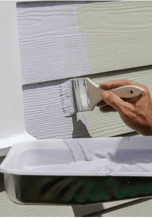 Exterior siding being painted